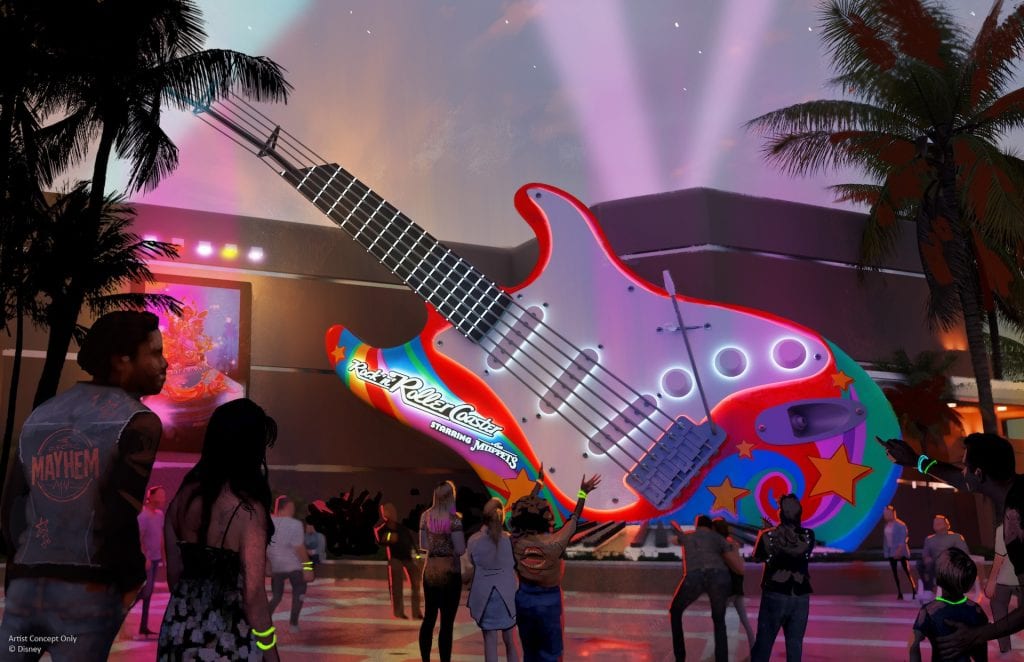 Nighttime scene showing a large guitar rethemed for Rock N Roller Coaster Muppets