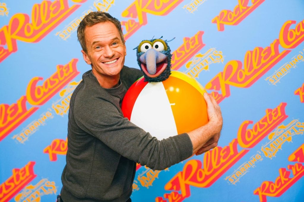 Neil Patrick Harris is hugging Gonzo, who appears to be in a beach ball
