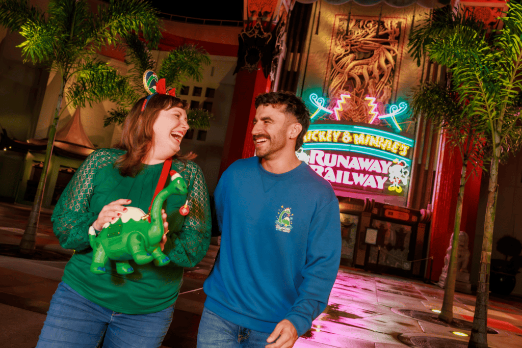 A couple smiling at Disney Jollywood Nights
